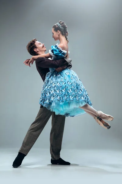 Contemporary ballroom dancers on grey studio background — Stock Photo, Image