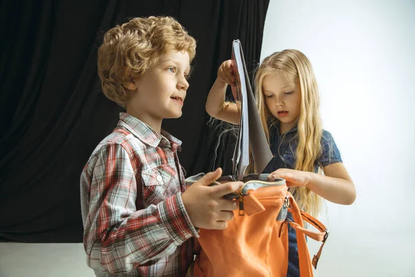 Boy and girl preparing for school after a long summer break. Back to school. — Stock Photo, Image