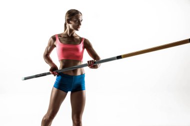 Beyaz stüdyo arka plan kadın sırıkla atlamacı eğitimi