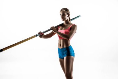 Beyaz stüdyo arka plan kadın sırıkla atlamacı eğitimi