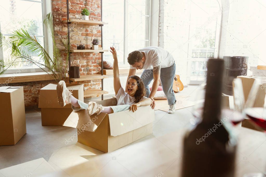 Young couple moved to a new house or apartment