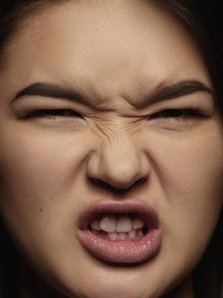 Close up portrait of young emotional woman