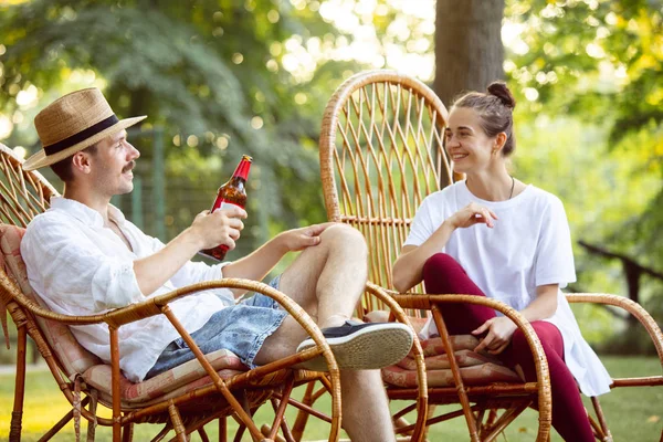 Happy couple at barbecue dinner on sunset time — Stock Photo, Image