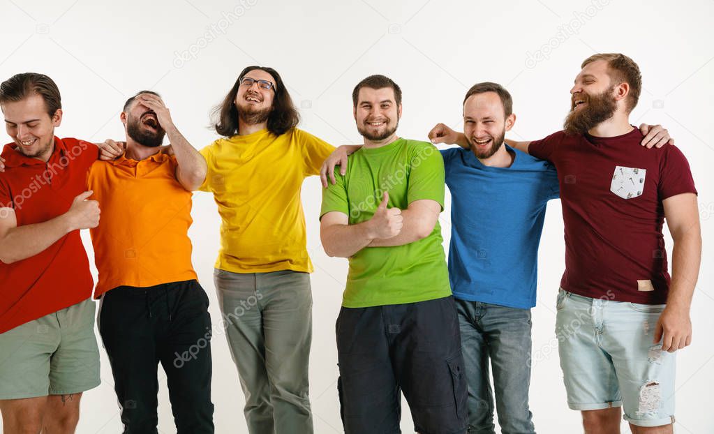 Young men weared in LGBT flag colors isolated on white background, LGBT pride concept