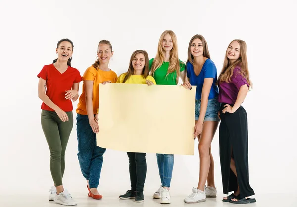 Young people weared in LGBT flag colors isolated on white background, LGBT pride concept — Stock Photo, Image