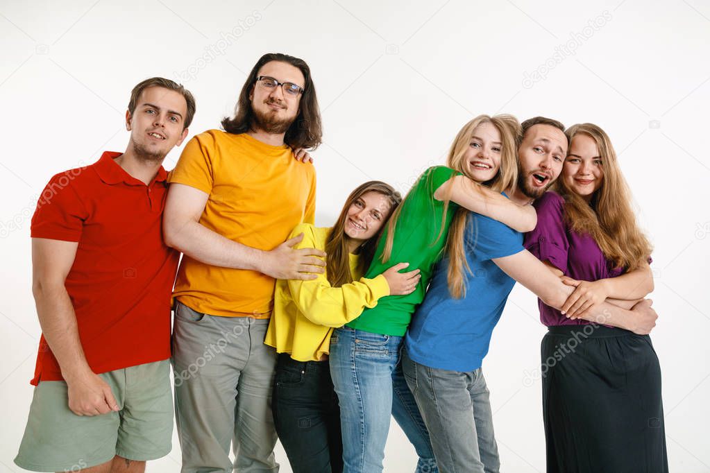 Young people weared in LGBT flag colors isolated on white background, LGBT pride concept
