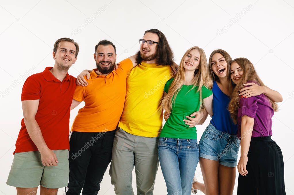 Young people weared in LGBT flag colors isolated on white background, LGBT pride concept