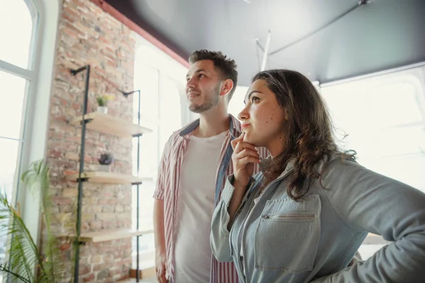 Young couple moved to a new house or apartment