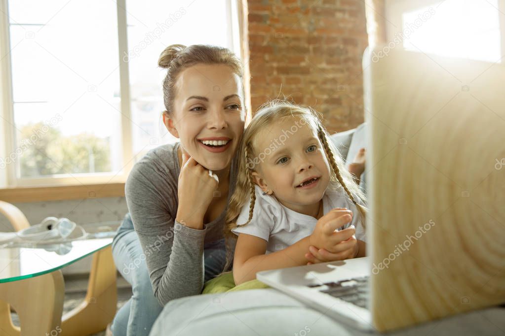 Teacher and little girl, or mom and daughter. Homeschooling concept