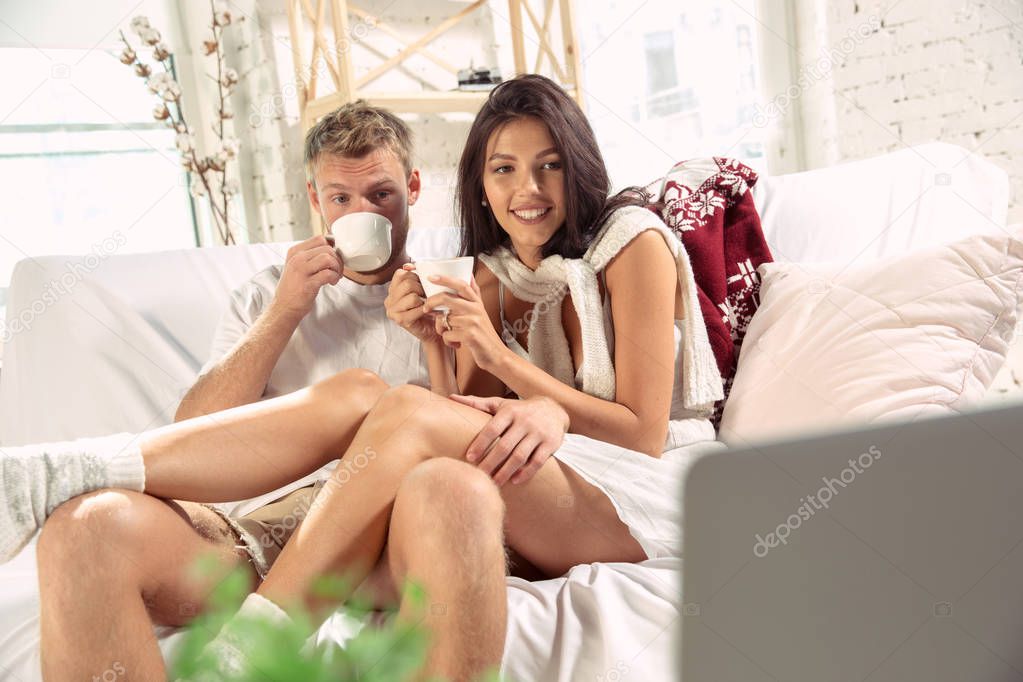 Couple of lovers at home relaxing together, comfortable