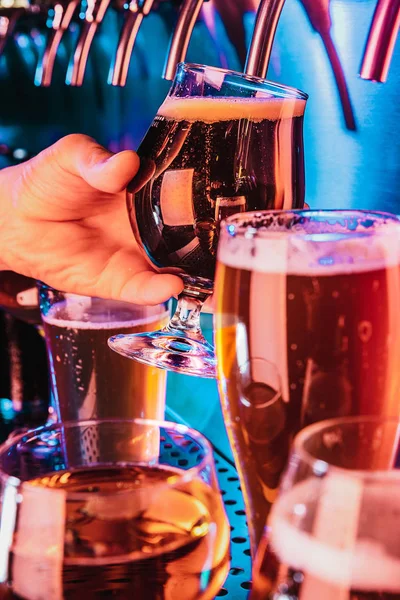 Hand of bartender pouring a large lager beer in tap — Stock Photo, Image