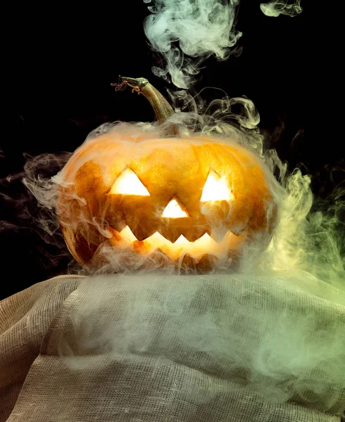 Halloween pumpkin head jack lantern with scary evil face — Stock Photo, Image