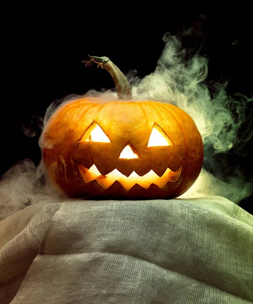 Halloween pumpkin head jack lantern with scary evil face — Stock Photo, Image