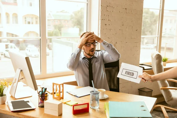 Young businessman fired, looks upset — Stock Photo, Image