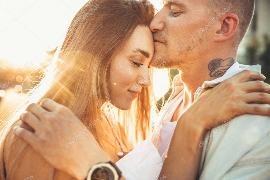 Tanned young caucasian couple, modern lovestory in film grain effect