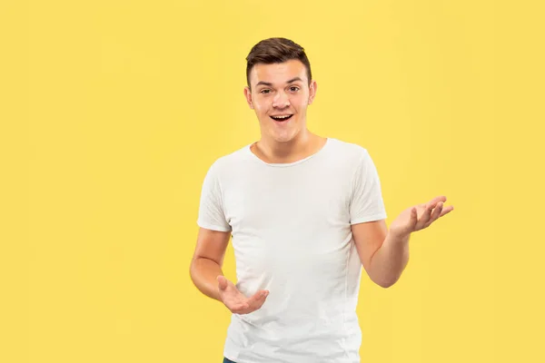 Caucasian young mans half-length portrait on yellow background — Stock Photo, Image