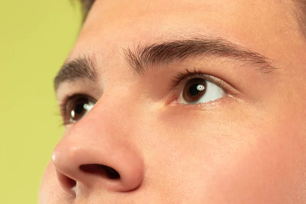 Caucasian young mans close up shot on green background — Stock Photo, Image