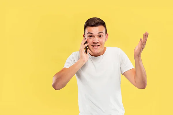 Caucasian young mans half-length portrait on yellow background — Stock Photo, Image