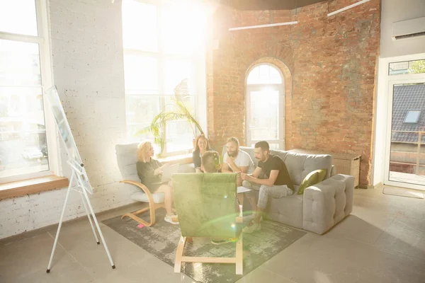Group of young caucasian office workers have creative meeting to discuss new ideas — Stok Foto