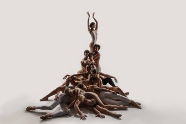 The group of modern ballet dancers. Contemporary art ballet. Young flexible athletic men and women. clipart