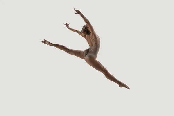 Modern ballet dancer. Contemporary art ballet. Young flexible athletic woman.