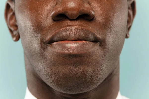 African-american young mans close up portrait on blue background — ストック写真