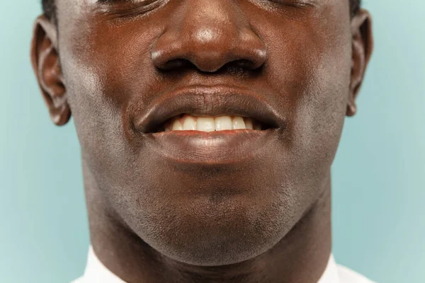 African-american young mans close up portrait on blue background — ストック写真