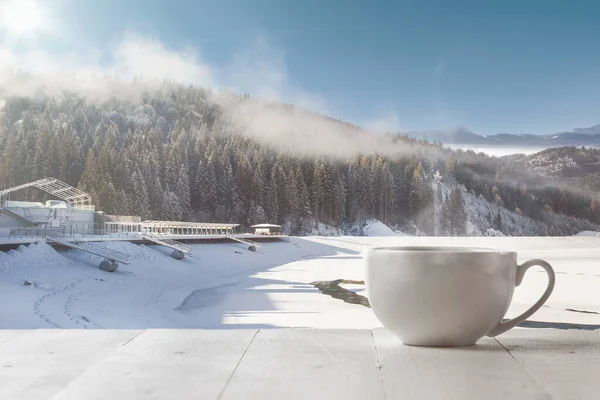 Single tea or coffee cup and landscape of mountains on background — Stock Photo, Image