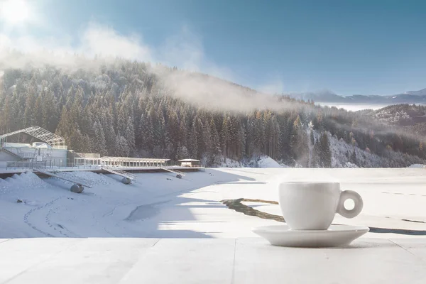 Single tea or coffee cup and landscape of mountains on background — Stock Photo, Image