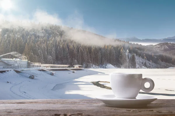 Single tea or coffee cup and landscape of mountains on background — Stock Photo, Image