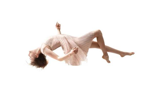 Mid-air beauty. Full length studio shot of attractive young woman hovering in air and keeping eyes closed — Stock Photo, Image