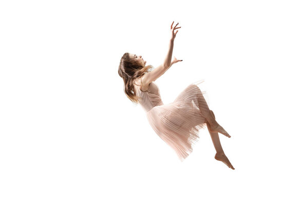 Mid-air beauty. Full length studio shot of attractive young woman hovering in air and keeping eyes closed