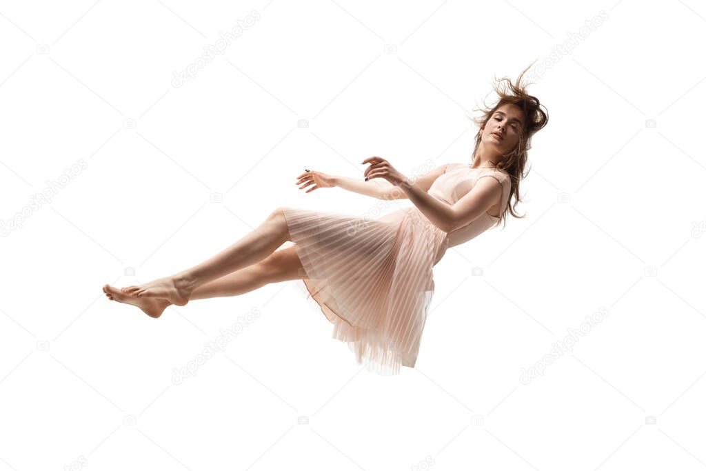 Mid-air beauty. Full length studio shot of attractive young woman hovering in air and keeping eyes closed