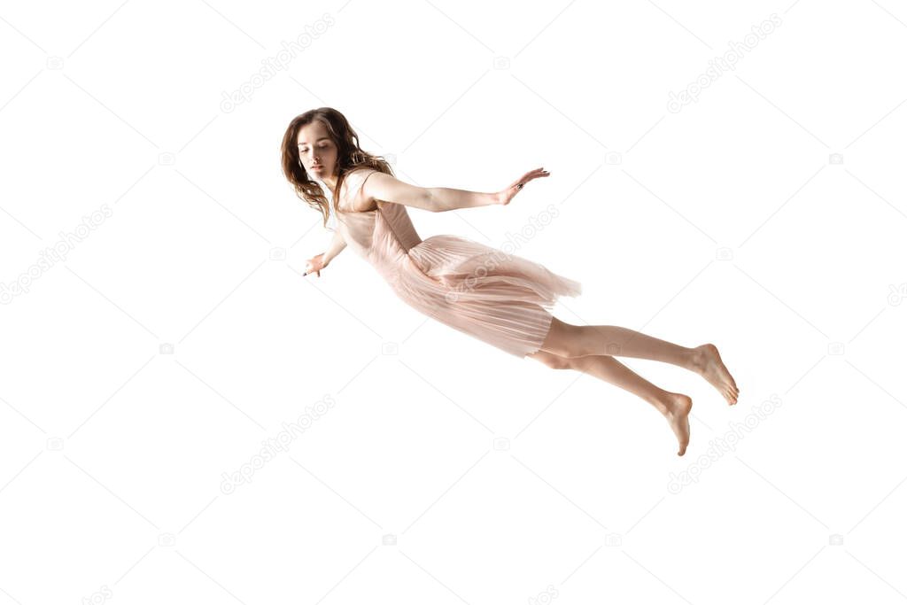 Mid-air beauty. Full length studio shot of attractive young woman hovering in air and keeping eyes closed