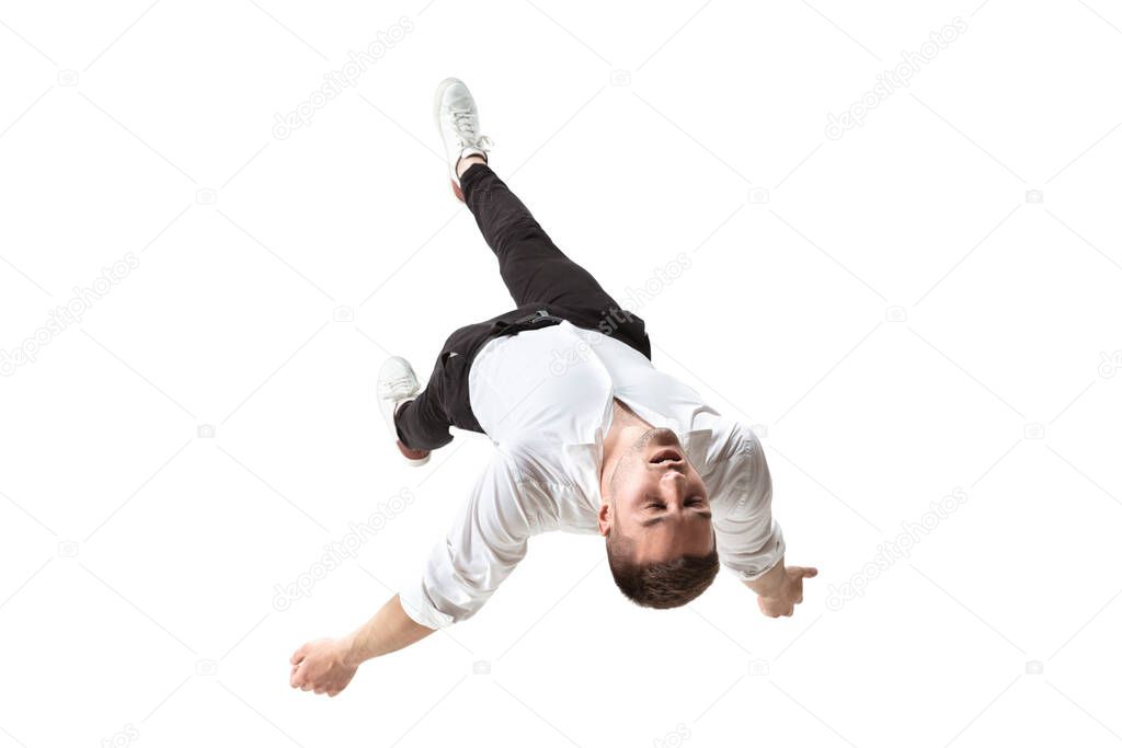 Mid-air beauty. Full length studio shot of attractive young man hovering in air and keeping eyes closed