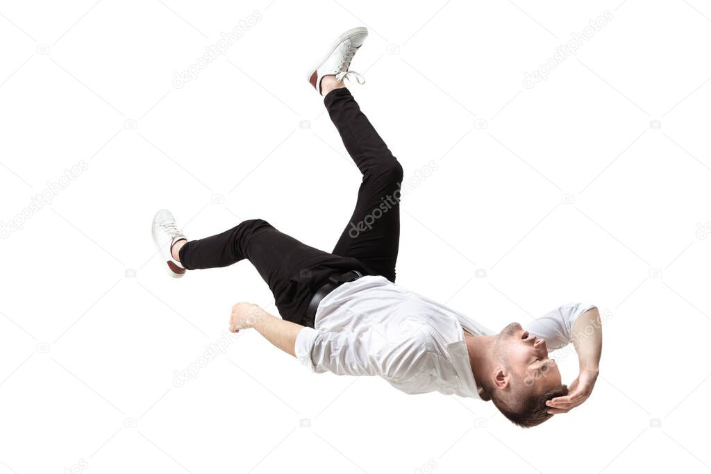 Mid-air beauty. Full length studio shot of attractive young man hovering in air and keeping eyes closed