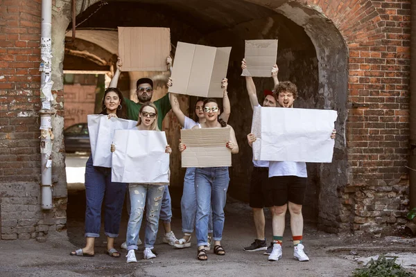 Diverse group of people protesting with blank signs. Protest against human rights, abuse of freedom, social issues — Stock Photo, Image