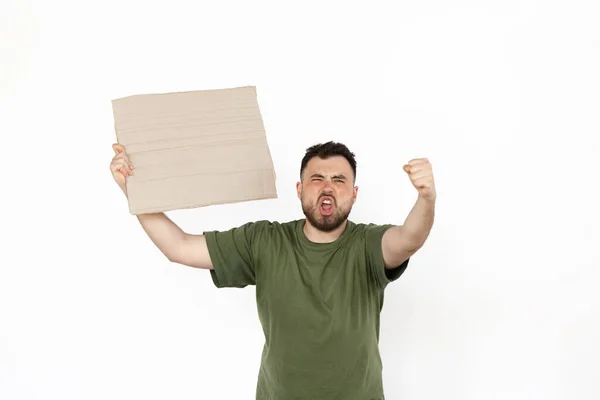 Young man protesting with blank board, sign isolated on white studio background — Stock Photo, Image
