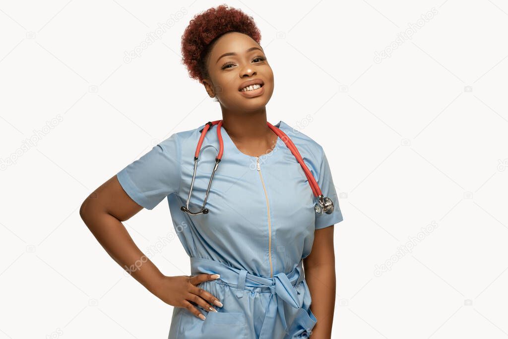 Beautiful african-american doctor or nurse smiling isolated over white studio background