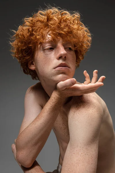 Portrait of beautiful redhead man isolated on grey studio background. Concept of beauty, skin care, fashion and style — Stock Photo, Image