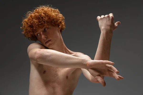 Portrait of beautiful redhead man isolated on grey studio background. Concept of beauty, skin care, fashion and style — Stock Photo, Image