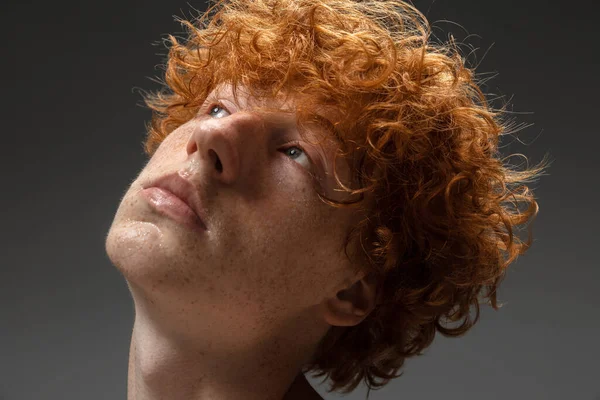 Portrait of beautiful redhead man isolated on grey studio background. Concept of beauty, skin care, fashion and style — Stock Photo, Image