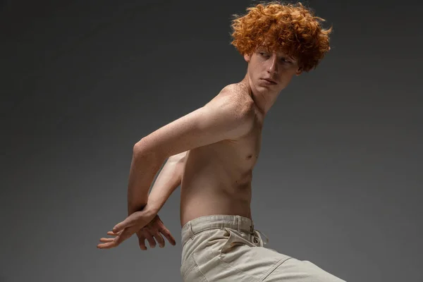 Portrait of beautiful redhead man isolated on grey studio background. Concept of beauty, skin care, fashion and style — Stock Photo, Image