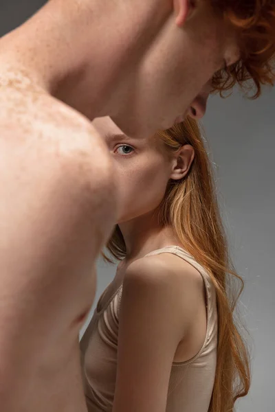 Portrait of beautiful redhead couple isolated on grey studio background. Concept of beauty, skin care, fashion and style — Stock Photo, Image