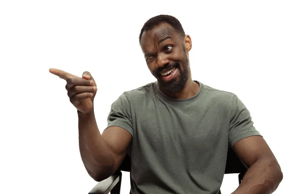 Young african-american man with funny, unusual popular emotions and gestures isolated on white studio background — Stock Photo, Image