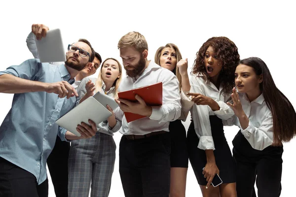 Nervous tensioned investors analyzing crisis stock market with charts on screen of their gadgets