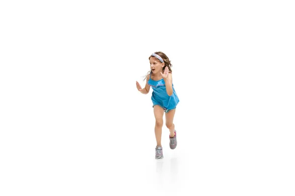 Happy little caucasian girl jumping and running isolated on white background — Stock Photo, Image