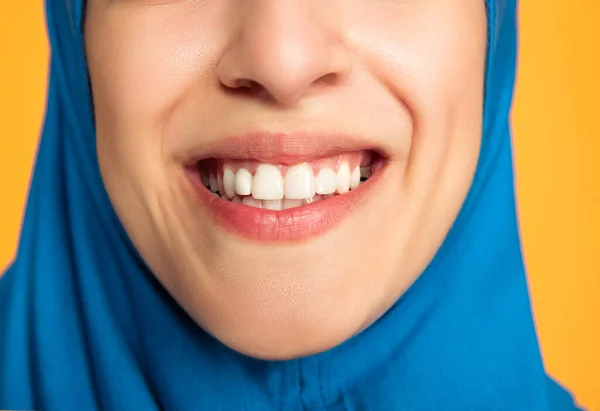 Portrait of young muslim woman isolated on yellow studio background — Stock Photo, Image