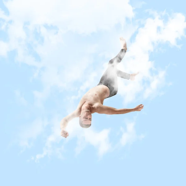 Красавица в воздухе. Полнометражный студийный снимок привлекательного молодого человека, висящего в воздухе и закрывающего глаза — стоковое фото