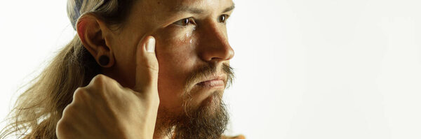 Caucasian young mans close up shot on studio background, flyer